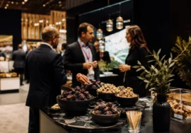 Product tasting and buyer conversation featuring premium nuts and dates